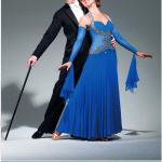 Dance Down The Danube with Anton & Erin screenshot showing Anton & Erin in tailsuit, top hat, cane and [Erin] ballgown. Below text detailing dates of trip