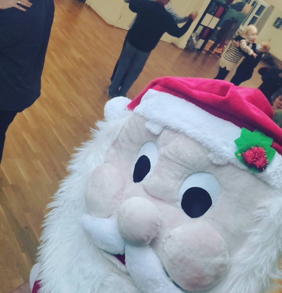 Antony wearing a Father Christmas/Santa mascot head during our last night of classes before the dance school closes for Christmas 2021