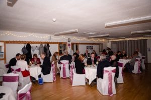 A wide shot of Learn To Dance students at our Valentine Dinner Dance.

Tables of four with white table clothes, white chair covers with mauve satin sashes.