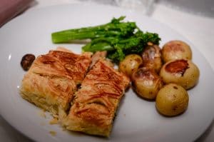 Mushroom wellington with buttered new potatoes and broccoli