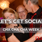A couple in a loose ballroom hold with a smiling face 'photo bombing'. Overlaid the text 'Let's get social' above Cha Cha Cha week. Learn To Dance logo in bottom right corner